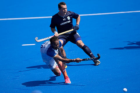 Lalit Kumar Upadhyay passes the ball duing the match against Argentina